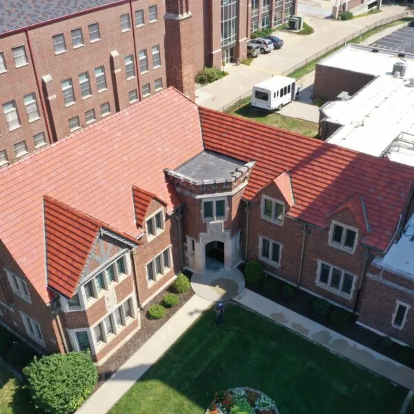 Historic building with a red tile roofing system installed by Bluegrass Brothers Roofing in Louisville, KY